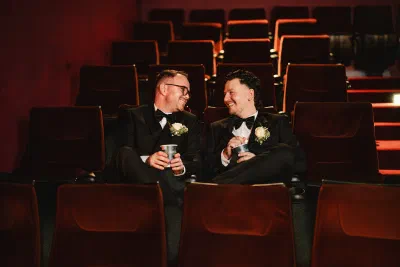 Grooms at a vintage cinema on their Dublin wedding day