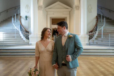 Bride and groom standing together in the atrium of the National Gallery of Ireland